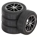 Four Stacked Car Tires With One Beside Featuring Alloy Rims