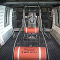 Gray Military Helicopter With Rotor System Cabin Windows And External Fuel Tanks