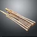 Natural Rustic Wooden Sticks With Textured Surface Stacked On Black Background