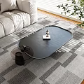 Black Oval Coffee Table In Modern Living Room With Sunlight Light Shadows Sofa And Rug