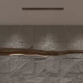 Natural Wooden Branch Pendant Light Hanging Over Textured Stone Wall Interior