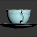 Light Blue Teacup and Saucer with Gold Floral Patterns Holding Latte with Swirl Art