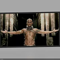 Television Screen Displaying Muscular Man With Outstretched Arms Chains And Ancient Columns Background