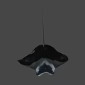 White Manta Ray With Black Spots Swimming In Deep Blue Ocean