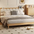 Modern Wooden Double Bed With Rounded Headboard Pillows And Blanket On Patterned Rug