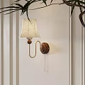 Vintage Wall Lamp With Wooden Base And Floral Patterned Lampshade On White Wall