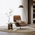 Brown Leather Single Sofa with Small Side Table Plant Floor Lamp and Modern Rug