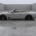 White Luxury Convertible Car With Beige Seats Large Alloy Wheels In Minimalist Indoor Space