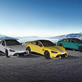 Colorful Cars Parked on Open Ground With Mountain and Lake View