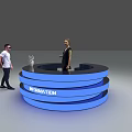Blue Circular Information Desk With Two People Standing Nearby