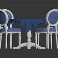Round Blue Tabletop Dining Table Set with White Legs and Blue Cushioned Chairs