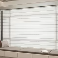 Modern White Roller Blinds In Living Space With Window Bench And Book