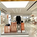 Fashion Clothing Store Interior With Mannequins Clothing Racks And Bright Lighting