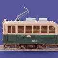 Vintage Green And White Tram With Number 1206 Headlights On And Pantograph