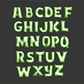 Green 3D Alphabet Letters Decorative Ornament Set Arranged with Shiny Finish on Dark Background