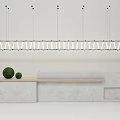 Modern Style Reception Desk With Wooden Countertop White Pendant Lights And Green Spherical Decorations