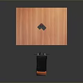 Black And Orange Computer Stand On Wooden Desktop With Small Black Holder