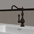 Elegant Brass Faucet on TOTO Sink with White Countertop and Floral Wallpaper