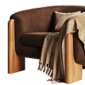 Brown Velvet Armchair with Wooden Legs Pillow and Fringe Blanket
