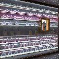 Elegant Wine Cabinet With Illuminated Glass Shelves And Wine Bottles Glassware