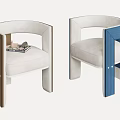 Modern Dining Chairs With Curved Backrest White Fabric Seats Brown And Blue Frames And Magazines On Seat