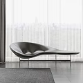 Black Leather Curved Sofa In Modern Interior With Large Windows And Green Park View