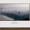 Wall Mounted Television Showing Urban City Landscape With Stacked Books