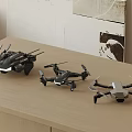 Fun Remote Control Drone Toys With Three Different Designs On Wooden Table 3d model