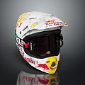 White Motorcycle Helmet With Red Bull Fox Logos Black Goggles And Racing Graphics