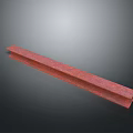 Red Long Strip Material With Textured Surface And Shiny Finish On Dark Background