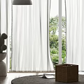 White Sheer Curtains With Modern Pendant Light And Cactus Plant In Sunlit Room