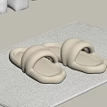 Cream Colored Slippers On Textured Mat For Cozy Home Bathroom Decor