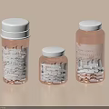 Three Transparent Plastic Bottles With White Lids Printed Labels And White Tablets Inside