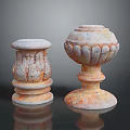 Two Classical Stone Pillars With Carved Leaf Patterns And Textured Bases