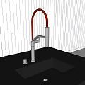 Modern Kitchen Faucet With Red Curved Spout And Chrome Base On Black Countertop With Sink