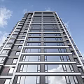 Modern Residential Building Exterior With Glass Windows Stone Facade And Pedestrians At Entrance