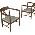 Two Wooden Dining Chairs With Armrests Light Colored Upholstered Seats And Simple Design