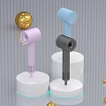 Colorful Handheld Daily Electrical Appliances in Pink Blue Black with White Stands and Golden Balls