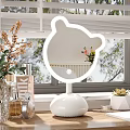 Cute Bear Shaped LED Lighted Mirror with White Base on Vanity Table with Cosmetics 3d model