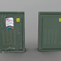 Two Green Metal Electrical Cabinets With Warning Signs And Colored Sticker