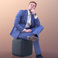 Thoughtful Man Sitting In Blue Suit With White Shirt Watch And Crossed Legs Posture