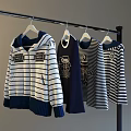Hanging Casual Hooded And Striped Tops On Hangers With Blue White And Dark Blue Colors