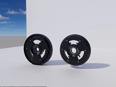 Two Black Circular Stove Components Against White Wall And Blue Sky 3d model