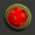 Green Barrel Shaped Weapon With Red Top Yellow Stripe Base Stand And Red Surface Spots