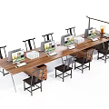 Long Wooden Office Desk With Multiple Computers Black Chairs And Office Supplies