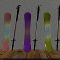 Pink Purple Yellow Snowboards And Ski Poles Leaning Against Wall On Wooden Floor