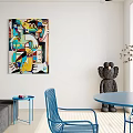 Modern Dining Living Room Interior With Blue Chairs Table Black Sofa And Colorful Abstract Art