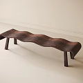 Wooden Wave Shaped Stool with Four Legs in Light Colored Indoor Room Setting