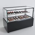 Glass Display Cabinet With Two Tiered Shelves For Chocolates And Strawberry Topped Desserts