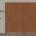 Modern Wooden Double Door Wardrobe With Paneled Doors And Green Plant In Interior